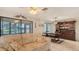 Inviting living room shows a comfortable couch, a water view, and a dining area at 3119 Glen Elyn Blvd # 9, Sarasota, FL 34237