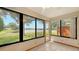 Sunroom features large windows with views of the water and surrounding greenery at 3119 Glen Elyn Blvd # 9, Sarasota, FL 34237