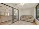Bright sunroom with lake views, tile floors, and access to the main living areas at 3119 Glen Elyn Blvd # 9, Sarasota, FL 34237