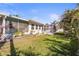 Lush backyard featuring tropical plants and a screened-in pool, offering a serene and private outdoor space at 3672 Pine Rd, Venice, FL 34293