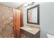 Bathroom featuring tile shower with grab bar, and a granite vanity at 3672 Pine Rd, Venice, FL 34293