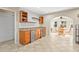 Dining area with bright natural lighting and bar with wine cooler at 3672 Pine Rd, Venice, FL 34293