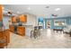 Bright, airy living room connected to an eat-in kitchen with modern appliances at 3672 Pine Rd, Venice, FL 34293