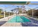 Screened-in pool area with a refreshing pool, perfect for relaxation and entertaining at 3672 Pine Rd, Venice, FL 34293