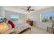Cozy bedroom with a water view, a ceiling fan, and carpeted floors at 435 S Gulfstream Ave # 804, Sarasota, FL 34236
