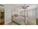 Bedroom featuring neutral décor and a large window, adjacent to the bathroom at 435 S Gulfstream Ave # 804, Sarasota, FL 34236