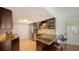 Well-lit kitchen with granite counters, stainless steel appliances, and a breakfast bar with stools at 435 S Gulfstream Ave # 804, Sarasota, FL 34236