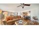 Open living room featuring a wet bar, hardwood floors, and access to the kitchen and dining area at 435 S Gulfstream Ave # 804, Sarasota, FL 34236