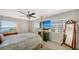 Comfortable main bedroom with a ceiling fan and beautiful water views from the large windows at 435 S Gulfstream Ave # 804, Sarasota, FL 34236