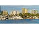 Scenic view of luxury condos, boats, and waterfront in a serene setting at 435 S Gulfstream Ave # 804, Sarasota, FL 34236