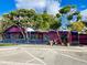 Exterior of a colorful Mexican restaurant with a bright pink facade, blue accents, and outdoor seating at 470 Leach St, Englewood, FL 34223