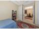 Bedroom features tiled flooring and a decorative red patterned area rug at 5246 Manorwood Dr # 4, Sarasota, FL 34235