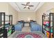 Bedroom featuring two twin beds, bookshelves, and a colorful rug at 5246 Manorwood Dr # 4, Sarasota, FL 34235