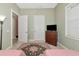 Comfortable bedroom highlighting closet space and a charming color scheme at 5246 Manorwood Dr # 4, Sarasota, FL 34235