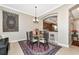 Dining room with a round glass table, seating for six, and decoratives at 5246 Manorwood Dr # 4, Sarasota, FL 34235