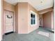 Inviting condo hallway with a view of the front door and exterior window at 5246 Manorwood Dr # 4, Sarasota, FL 34235