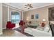 An elegant living room with a neutral color palette and views of the outdoor balcony at 5246 Manorwood Dr # 4, Sarasota, FL 34235