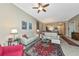 Bright living room featuring tile floors, neutral walls, ceiling fan and tasteful furniture arrangement at 5246 Manorwood Dr # 4, Sarasota, FL 34235