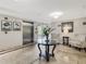 Welcoming lobby featuring travertine floors, seating area, and elevator access for added convenience at 5246 Manorwood Dr # 4, Sarasota, FL 34235