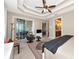 Main bedroom features sliding door to a balcony and an ensuite bathroom at 5246 Manorwood Dr # 4, Sarasota, FL 34235