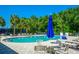 Beautiful pool with lounge seating and chairs, perfect for summer days in the sun at 5246 Manorwood Dr # 4, Sarasota, FL 34235