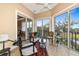 A relaxing sunroom boasts natural light and community views at 5246 Manorwood Dr # 4, Sarasota, FL 34235