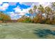 Perfectly kept tennis court, ready for matches under sunny skies at 5246 Manorwood Dr # 4, Sarasota, FL 34235