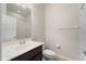 Bright bathroom featuring a vanity with a dark wood cabinet and tile floors at 5435 Soapstone Place # 22-103, Sarasota, FL 34233