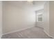 Bedroom featuring neutral carpet, a ceiling fan, and a window allowing natural light at 5435 Soapstone Place # 22-103, Sarasota, FL 34233