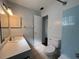 Bathroom features tiled shower, toilet, and vanity with sink at 6024 Arlene Way, Bradenton, FL 34207