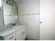 Well-lit bathroom featuring a white vanity with a mirror and overhead lighting at 6024 Arlene Way, Bradenton, FL 34207