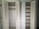 Open folding shutter door closets with shelving at 6024 Arlene Way, Bradenton, FL 34207
