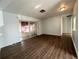 Open living room featuring hard surface flooring and sliding doors to a screened patio at 6024 Arlene Way, Bradenton, FL 34207
