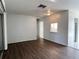 Open living room featuring hard surface flooring with a view through to the kitchen at 6024 Arlene Way, Bradenton, FL 34207