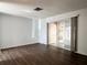 Open living room featuring hard surface flooring and sliding doors to a screened patio at 6024 Arlene Way, Bradenton, FL 34207