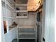 Storage space with shelving and electrical box at 6024 Arlene Way, Bradenton, FL 34207