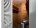 Compact utility room with shelves and an energy-efficient water heater at 6024 Arlene Way, Bradenton, FL 34207