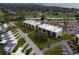 Stunning aerial view shows a neighborhood featuring manicured lawns and residential buildings and community areas at 6116 43Rd W St # 204D, Bradenton, FL 34210