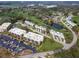 Overhead shot of a well-planned golf community with ample parking and lush green surroundings at 6116 43Rd W St # 204D, Bradenton, FL 34210