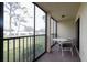 A spacious balcony showcasing a seating area and a scenic view of the surrounding landscape at 6116 43Rd W St # 204D, Bradenton, FL 34210