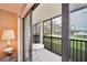 A cozy balcony offering a serene view of the outdoors with a table and chairs for relaxing at 6116 43Rd W St # 204D, Bradenton, FL 34210