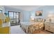 Comfortable bedroom features a balcony and serene atmosphere at 6116 43Rd W St # 204D, Bradenton, FL 34210