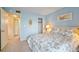 This comfortable bedroom features a light blue wall and an ensuite bathroom with a closet at 6116 43Rd W St # 204D, Bradenton, FL 34210