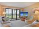 Inviting living room with a large sliding glass doors that open to the outside area at 6116 43Rd W St # 204D, Bradenton, FL 34210