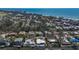 Waterfront home with boat dock on canal, with beach and cityscape views beyond at 619 Buttonwood Dr, Longboat Key, FL 34228