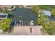 Aerial view of property showing private boat dock with multiple boats and beautiful waterfront access at 619 Buttonwood Dr, Longboat Key, FL 34228