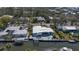 Waterfront home with boat dock and patio located on a canal in a residential neighborhood at 619 Buttonwood Dr, Longboat Key, FL 34228