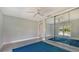 Bright bedroom with large closet mirrors and a blue rug at 619 Buttonwood Dr, Longboat Key, FL 34228