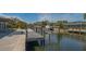 Waterfront views, with a boat lift and tropical landscaping at 619 Buttonwood Dr, Longboat Key, FL 34228