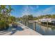 Dock views of a home with tropical landscaping at 619 Buttonwood Dr, Longboat Key, FL 34228